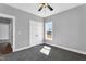 Empty bedroom with gray carpet, white trim, and natural light at 1178 Sheriff Johnson Rd, Lillington, NC 27546