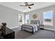 Inviting bedroom with ensuite bath boasts large windows and ample natural light at 1178 Sheriff Johnson Rd, Lillington, NC 27546