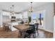 Open dining area provides access to the outdoors and views of the kitchen in this modern space at 1178 Sheriff Johnson Rd, Lillington, NC 27546