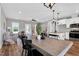 Open concept dining area connects the kitchen and living spaces in this modern, bright home at 1178 Sheriff Johnson Rd, Lillington, NC 27546
