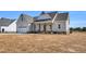 Inviting home exterior with a covered front porch and a convenient attached two-car garage at 1178 Sheriff Johnson Rd, Lillington, NC 27546