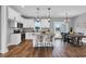 Bright open kitchen with island, granite countertops, stainless appliances, and access to a charming outdoor space at 1178 Sheriff Johnson Rd, Lillington, NC 27546