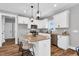 Stylish kitchen with a breakfast bar, granite countertops, stainless steel appliances, and custom white cabinetry at 1178 Sheriff Johnson Rd, Lillington, NC 27546