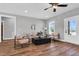 Bright living room featuring modern furniture and sleek ceiling fan at 1178 Sheriff Johnson Rd, Lillington, NC 27546