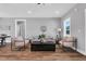 Bright living room with stylish seating and wood-look flooring at 1178 Sheriff Johnson Rd, Lillington, NC 27546