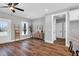 Well-lit living room featuring modern furnishings and wood-look flooring at 1178 Sheriff Johnson Rd, Lillington, NC 27546