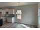 Bright dining area featuring wood floors, recessed lighting, and a stylish chandelier at 135 Jones Creek Ln Ln, Lillington, NC 27546