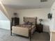 Bedroom with a metal bed frame and grey striped bedding at 166 Easy Wind Ln, Garner, NC 27529