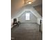 Spacious bonus room with carpet and a large window at 166 Easy Wind Ln, Garner, NC 27529