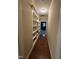 Built-in shelves line this hallway offering extra storage space at 166 Easy Wind Ln, Garner, NC 27529