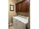 Bright laundry room with washer, dryer, and ample cabinetry at 166 Easy Wind Ln, Garner, NC 27529