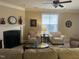 Living room with fireplace, two armchairs, and a sofa at 166 Easy Wind Ln, Garner, NC 27529