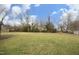 Spacious backyard with trees and lawn at 1805 Brown Ave, Burlington, NC 27215
