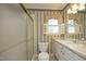Bathroom with shower/tub combo, vanity, and window at 1805 Brown Ave, Burlington, NC 27215