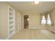 Bright bedroom with built-in shelves and carpet at 1805 Brown Ave, Burlington, NC 27215