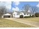 Side view of a Ranch home with carport and driveway at 1805 Brown Ave, Burlington, NC 27215
