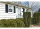 Front entrance with white door and black shutters at 1805 Brown Ave, Burlington, NC 27215