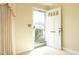 Open white front door with glass and brass accents at 1805 Brown Ave, Burlington, NC 27215