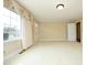 Living room features carpet, window, and door at 1805 Brown Ave, Burlington, NC 27215