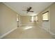 Spacious living room with neutral carpeting and ceiling fan at 1805 Brown Ave, Burlington, NC 27215