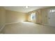 Bright living room with carpeted floors and window at 1805 Brown Ave, Burlington, NC 27215
