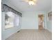 Bright sunroom with access to backyard and tile flooring at 1805 Brown Ave, Burlington, NC 27215