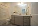 Modern bathroom with gray vanity and tiled floor at 1924 Robin Hill Ln, Raleigh, NC 27610