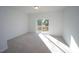 Bright bedroom with carpet and sliding glass door to deck at 1924 Robin Hill Ln, Raleigh, NC 27610