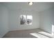 Spacious bedroom with carpet and large windows at 1924 Robin Hill Ln, Raleigh, NC 27610