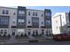 Modern three-story townhouses with gray and beige siding at 1924 Robin Hill Ln, Raleigh, NC 27610