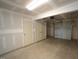 Attached garage with storage cabinets and overhead door at 1924 Robin Hill Ln, Raleigh, NC 27610