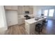 Modern kitchen with gray cabinets, island, and stainless steel appliances at 1924 Robin Hill Ln, Raleigh, NC 27610