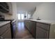 Contemporary kitchen with gray cabinets and stainless steel appliances at 1924 Robin Hill Ln, Raleigh, NC 27610