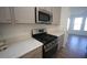 Modern kitchen features stainless steel appliances and gas range at 1924 Robin Hill Ln, Raleigh, NC 27610