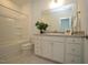 Bathroom boasts a vanity with granite countertop and a shower/tub combo at 1928 Robin Hill Ln, Raleigh, NC 27610