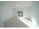 Bedroom with carpet and sliding glass door to deck at 1928 Robin Hill Ln, Raleigh, NC 27610