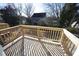 Private deck with wood railings offering a view of the neighborhood at 1928 Robin Hill Ln, Raleigh, NC 27610