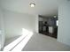 Bright dining area with view into kitchen and hardwood floors at 1928 Robin Hill Ln, Raleigh, NC 27610