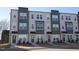 Three-story townhouses with modern design, neutral colors, and landscaping at 1928 Robin Hill Ln, Raleigh, NC 27610
