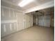 Attached garage with extra storage space and overhead door at 1928 Robin Hill Ln, Raleigh, NC 27610