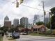 Residential street view showcasing the proximity to the city skyline at 1928 Robin Hill Ln, Raleigh, NC 27610