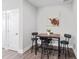 A dining area featuring a table with seating for four and a modern light fixture at 313 E Fourth St, Wendell, NC 27591