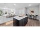 Bright kitchen featuring stainless steel appliances, modern decor, and a seamless flow to the living space at 313 E Fourth St, Wendell, NC 27591