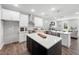 Modern kitchen with stainless steel appliances, ample storage space, and hardwood floors at 313 E Fourth St, Wendell, NC 27591