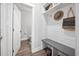 Mud room with storage, a bench, and access to a half bathroom at 313 E Fourth St, Wendell, NC 27591