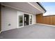 Covered patio showcasing a modern design with sliding glass doors leading to the interior at 313 E Fourth St, Wendell, NC 27591