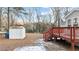 Backyard view with shed and deck at 402 Sparella St, Durham, NC 27703