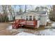 Home exterior with deck and snow covered yard at 402 Sparella St, Durham, NC 27703