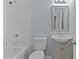 Clean bathroom with white subway tile, a vanity, and a bathtub at 402 Sparella St, Durham, NC 27703