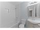 Bathroom with white subway tile, a bathtub, and a vanity at 402 Sparella St, Durham, NC 27703